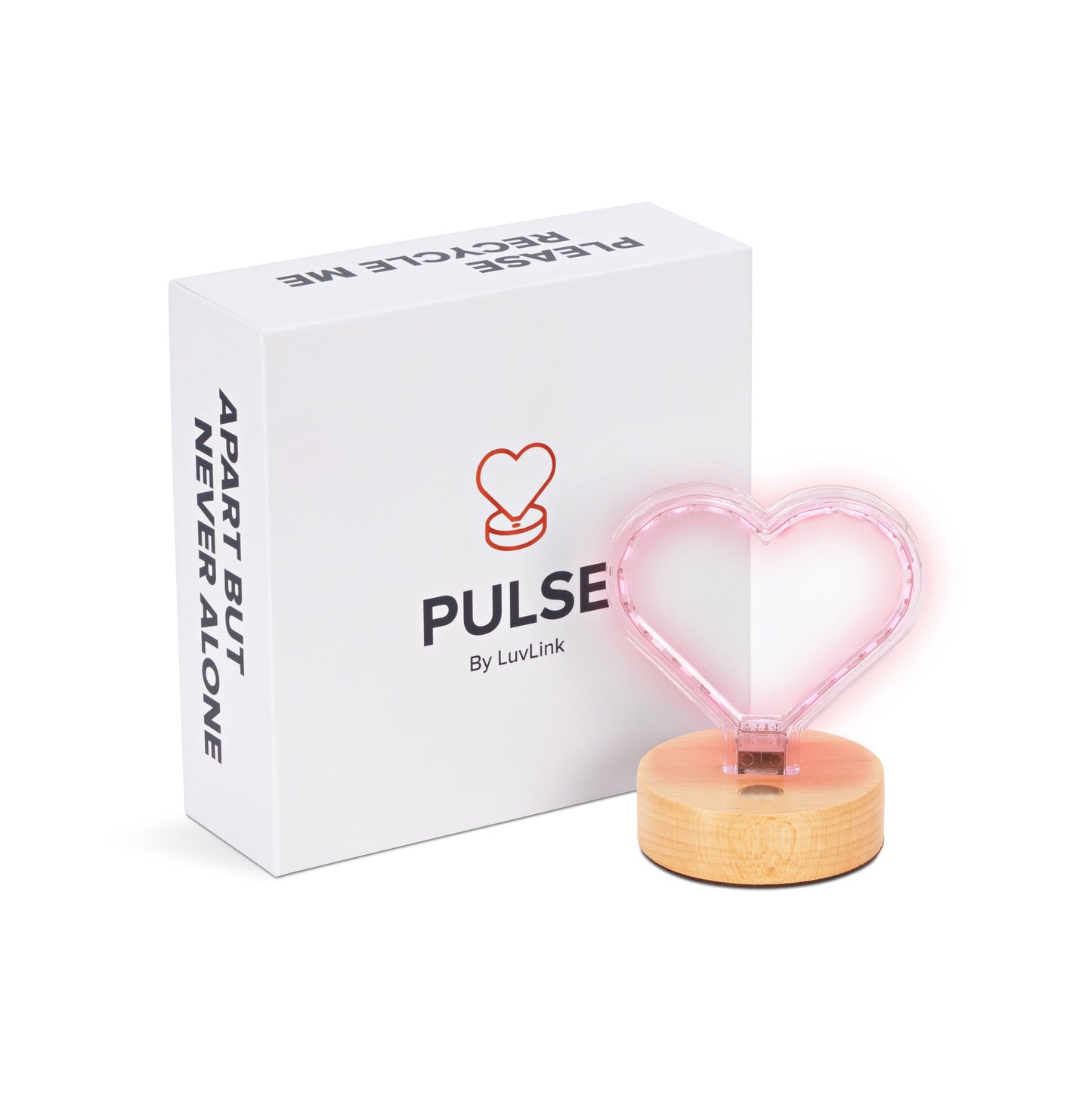 Pink heart-shaped Pulse lamp with wooden base positioned in front of its white branded box.