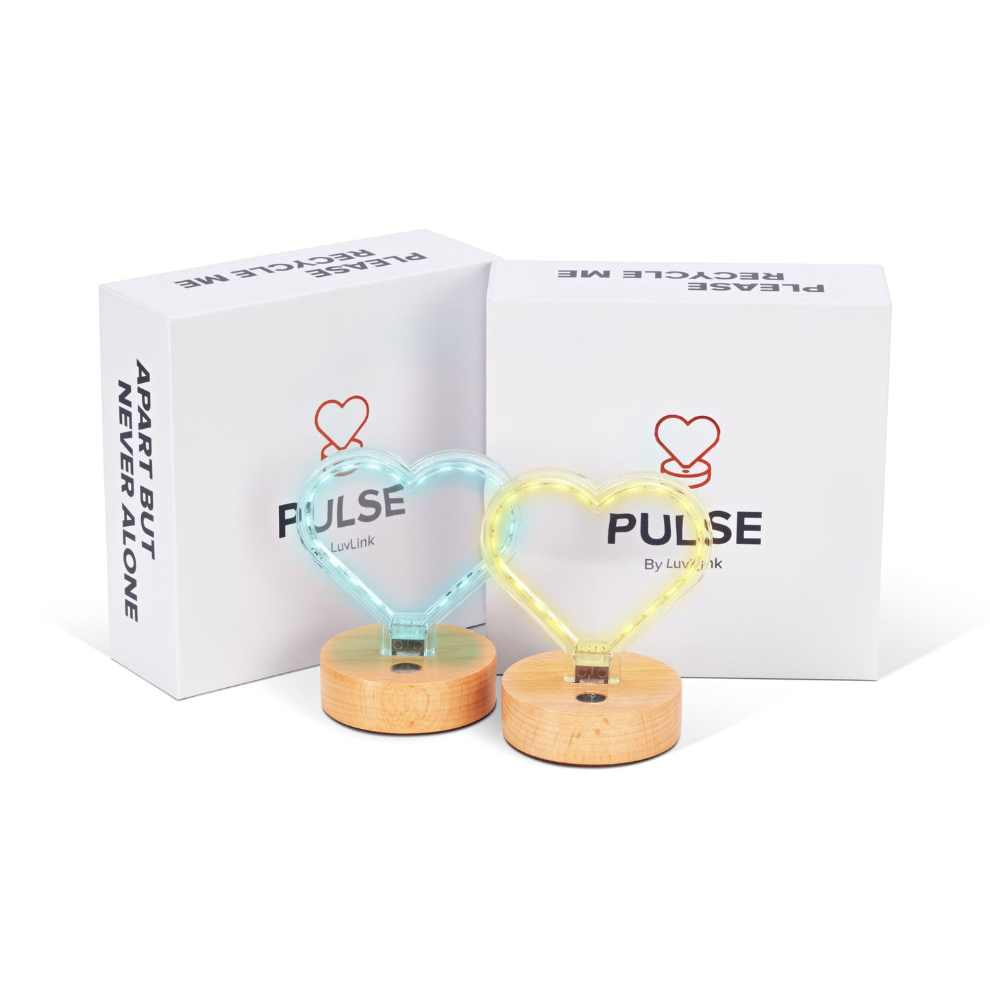 Pulse friendship lamp duo glowing in cyan and yellow heart shapes on timber bases with product boxes behind.