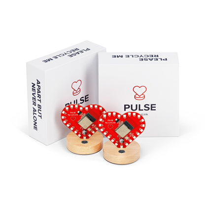 Pulse friendship lamps feature red heart designs with wooden bases, displayed with matching branded packaging.