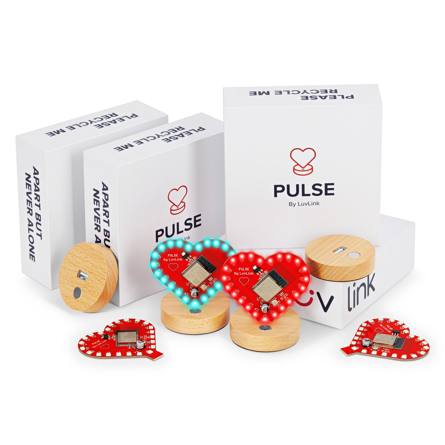 Pulse friendship lamp collection displayed with red and turquoise heart-shaped lamps alongside wooden bases and white product packaging.