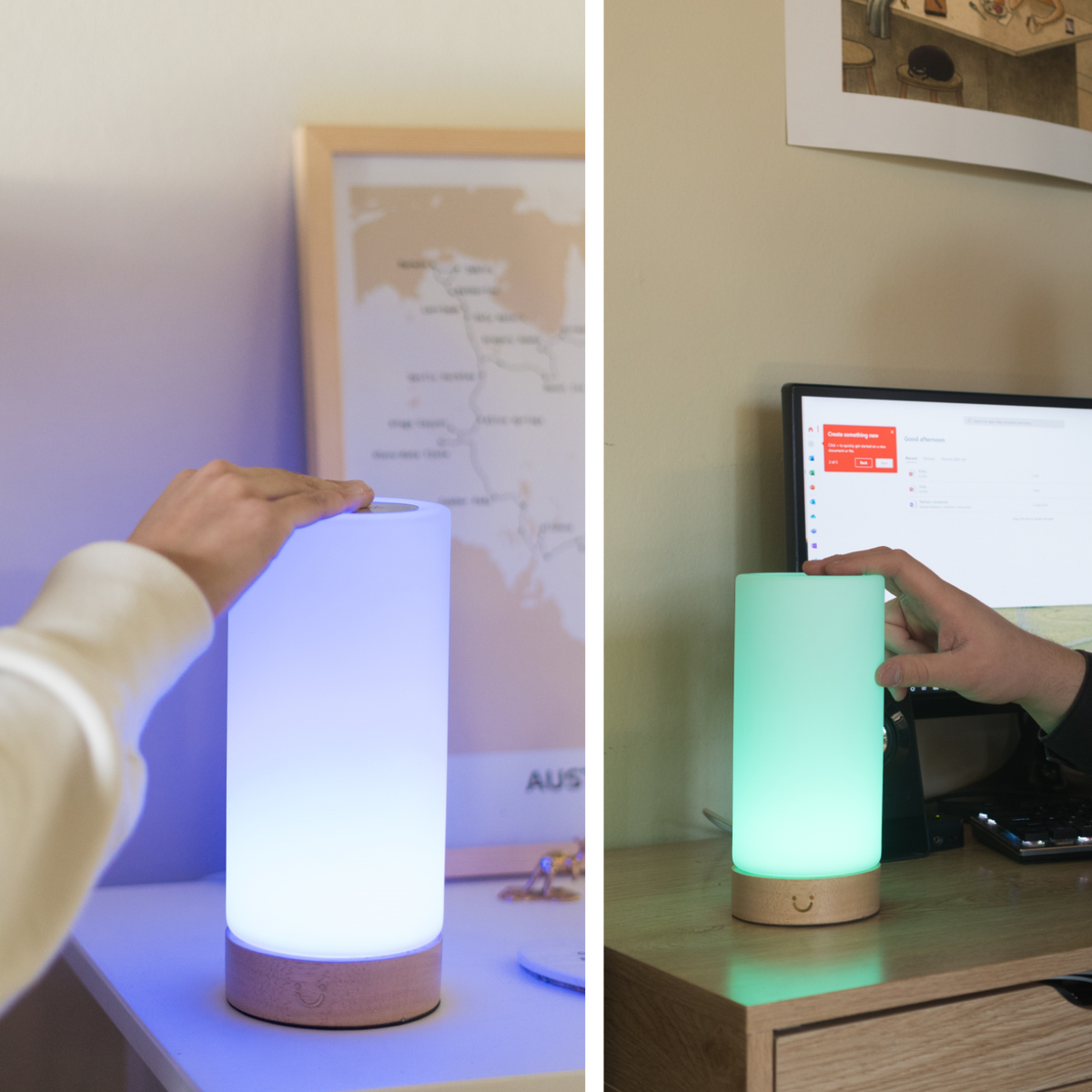 Two hands reach towards glowing cylinder lamps displaying white, blue and green light on home desks.