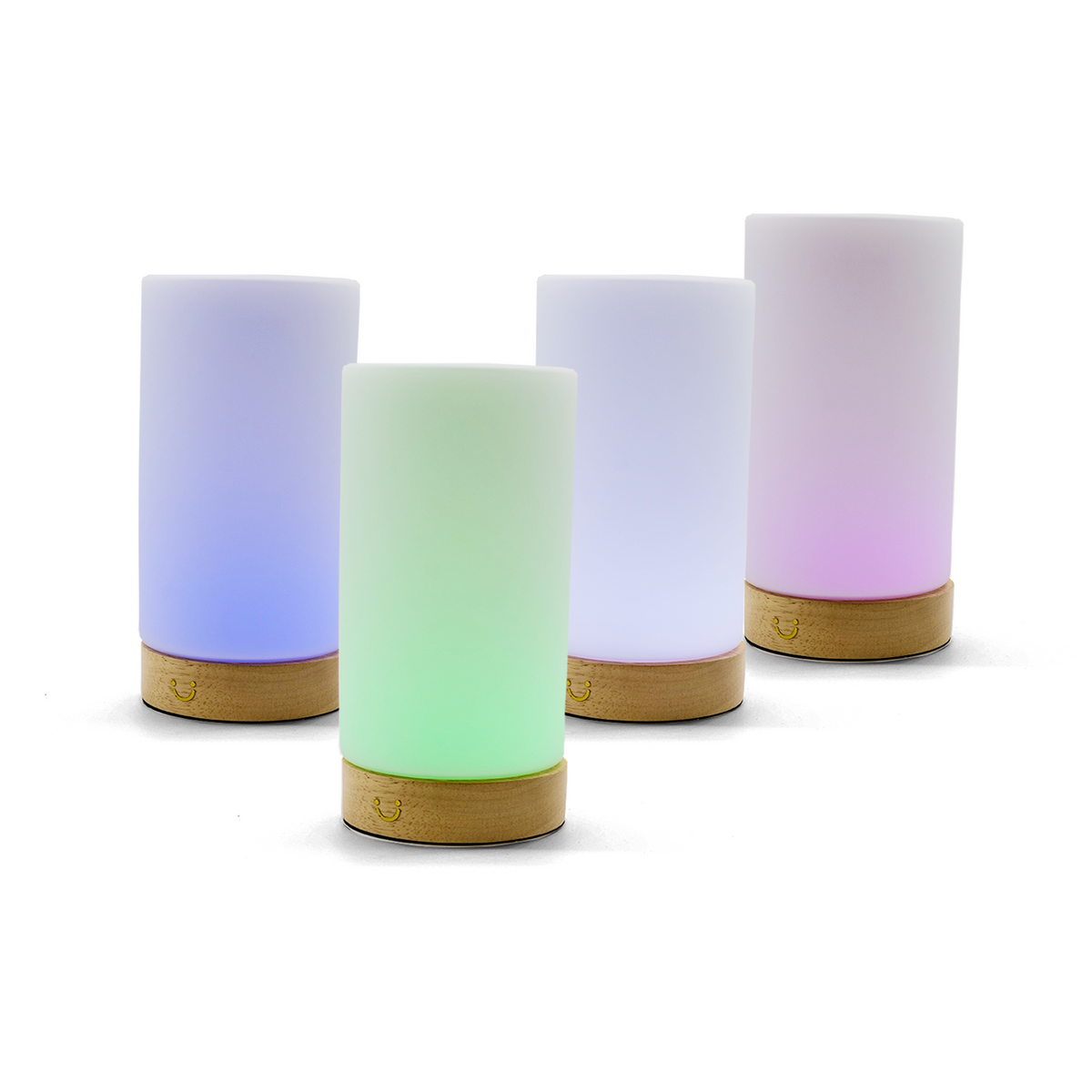 Cylindrical friendship lamps in blue, green, white and pink illuminate with wooden bases below.