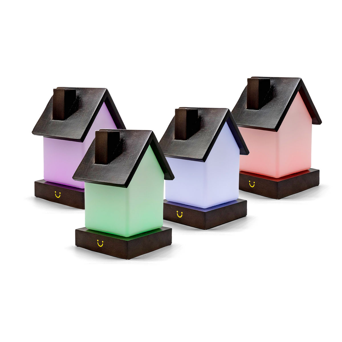 Grouped friendship lamps display purple, green, blue, pink and coral house-shaped bodies with slate roofs.
