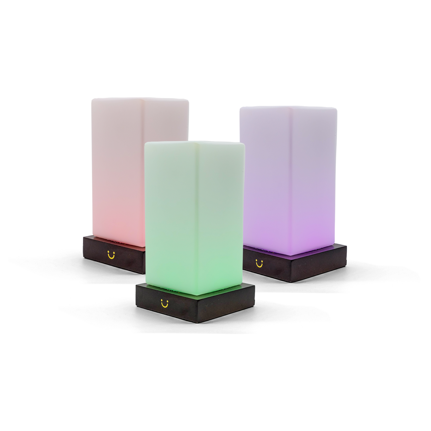 Friendship lamps in pink, green and purple gradient emit soft light from black magnetic bases.