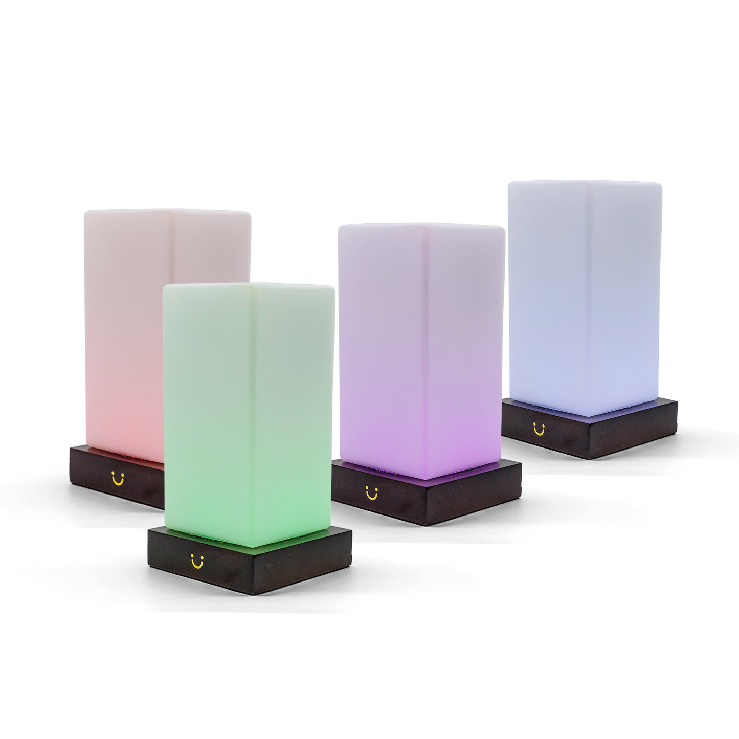 Colourful friendship lamps glow in pink, green, purple and blue with black charging bases.